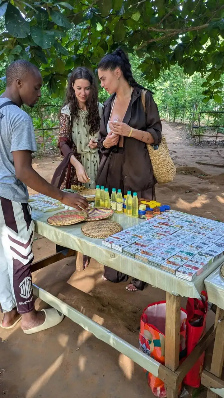 A table of spice soaps and bottled oils laid out for guests at the end of the walk.